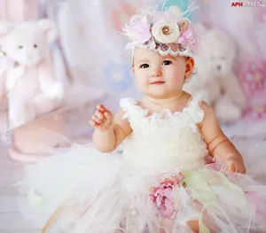 Baby In Floral Gown Wallpaper