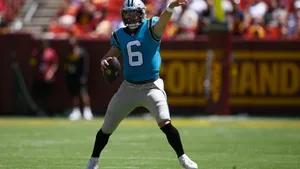 Baker Mayfield Throwing In The Field Wallpaper