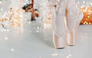 Ballet Shoes In A White Background With Lights Wallpaper