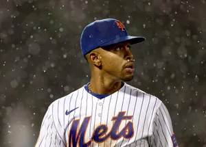 Baseball Playerin Rain During Game Wallpaper