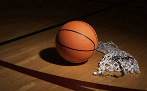 Basketball Ball And Net On Floor Wallpaper