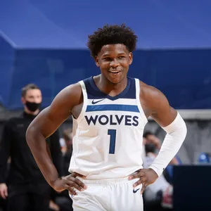 Basketball Player Smiling Courtside Wallpaper