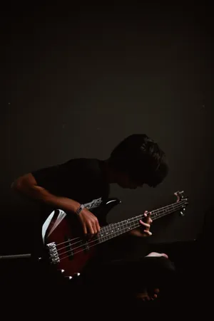 Bass Guitar Play Boy Dark Mobile Wallpaper