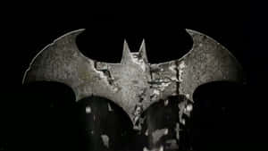 Batman Struggles Against The Darkness Of Arkham Asylum Wallpaper