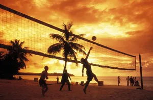 Beach Volleyball Silhouette And Orange Sky Wallpaper