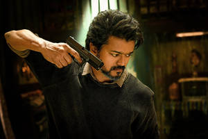 Beast Vijay Pointing Gun Wallpaper