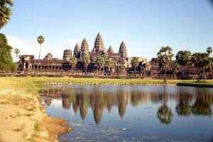 Beautiful Angkor Wat By The Water And Sky Wallpaper