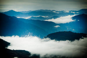 Beautiful Blue-tinted Mountain Ranges Wallpaper