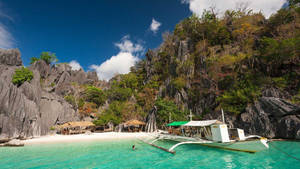 Beautiful Serenity At Banul Beach, Philippines Wallpaper