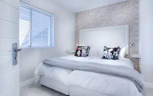 Bedroom With Marilyn Monroe Pillows Wallpaper