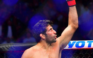 Beneil Dariush Raising His Victorious Left Arm After A Fight Wallpaper