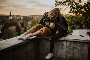 Best Friend Hugging In Balcony Wallpaper