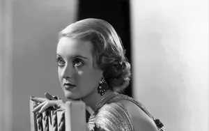 Bette Davis With Short Curly Hair Wallpaper