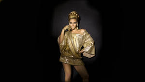 Beyonce In Short Gold Dress Wallpaper