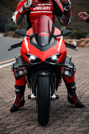 Bike Rider In Striking Red Color Wallpaper