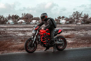 Bike Rider On The Road Wallpaper