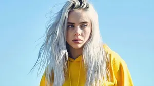 Billie Eilish Poses With A Laptop Wallpaper