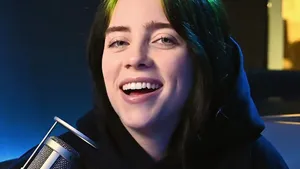 Billie Eilish Smiling Under The Setting Sun Wallpaper