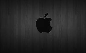 Black Apple Logo On Dark Wood Wallpaper