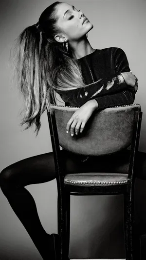 Black Ariana Grande On Chair Wallpaper