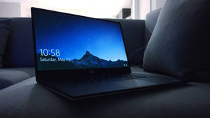 Black Best Laptop On Couch Wallpaper