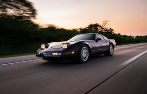 Black C4 Corvette In Motion Wallpaper