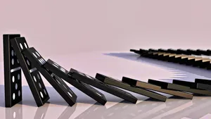 Black Dominos Falling Over Wallpaper