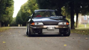 Black Jdm Nissan R32 Suburbs Wallpaper