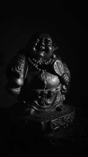 Black Laughing Buddha Statue Wallpaper