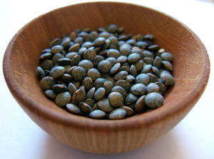 Black Lentils In Wooden Bowl Wallpaper