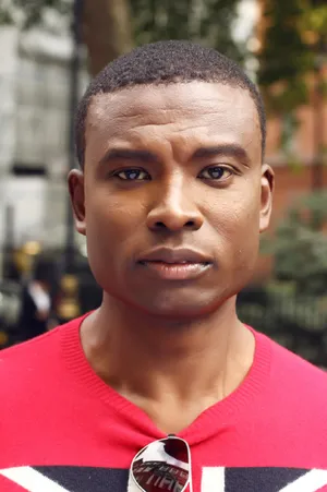 Black Man In Red And On The Street Wallpaper