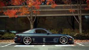 Black Mazda Rx 7 In Parking Lot Wallpaper