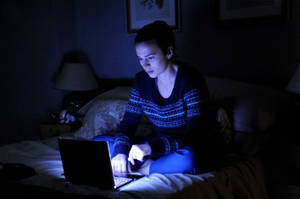 Black Mirror Girl On The Bed With Laptop Wallpaper