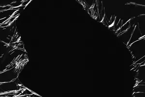 Black Plastic Ripped Wallpaper