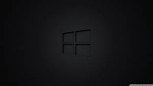 Black Windows Logo On A Dark Screen Wallpaper