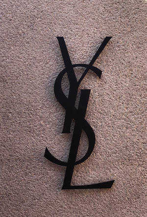 Black Ysl Logo At Wall Wallpaper