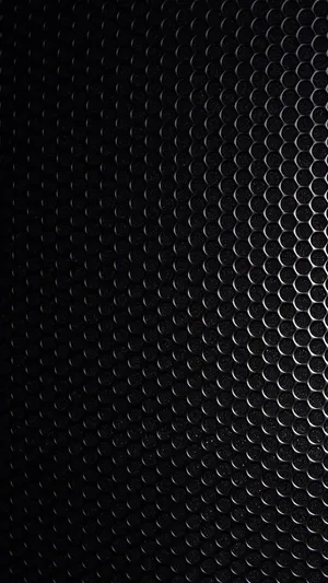Blank Black Steel Plate With Holes Wallpaper