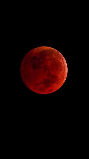 Blazing Red Moon Over The Cityscape Wallpaper