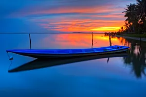 Blue Boat At Dusk Wallpaper