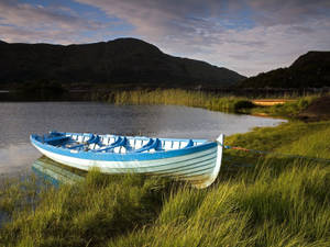 Blue Boat On Ireland River Wallpaper