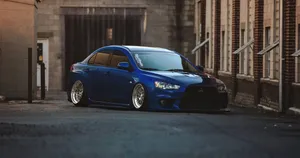 Blue Jdm Mitsubishi Evo At Building Wallpaper