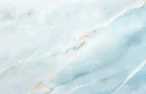 Blue Marble Laptop On A Wooden Surface Wallpaper