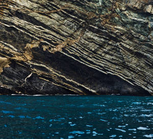 Blue Water Huge Rocks Macos Wallpaper