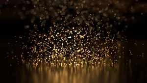 Blurred Black And Gold Glitter Wallpaper