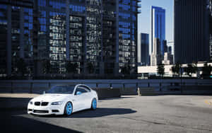 Bmw At Building Rooftop Parking Lot Wallpaper