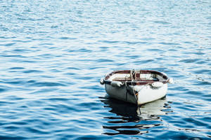 Boat And Moving Water Wallpaper