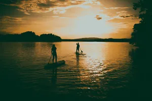 Boating During A Calming Sunset Wallpaper