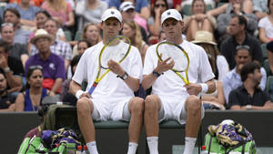 Bob Bryan And Mike Inspecting Rackets Wallpaper