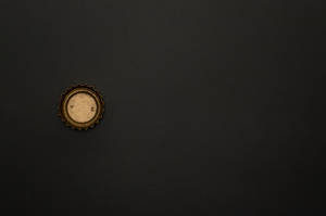 Bottle Cap Black And Gold Iphone Wallpaper