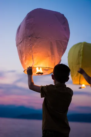 Boy And Flying Lantern Wallpaper